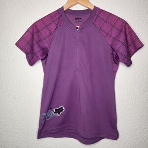 Fox Cycling Purple Shirt with Checkered Sleeves And Logo. Size Medium